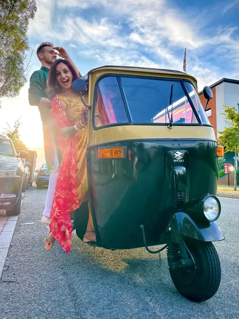 Krishna and Matt arriving in their wedding rickshaw